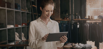 woman shop owner working on tablet